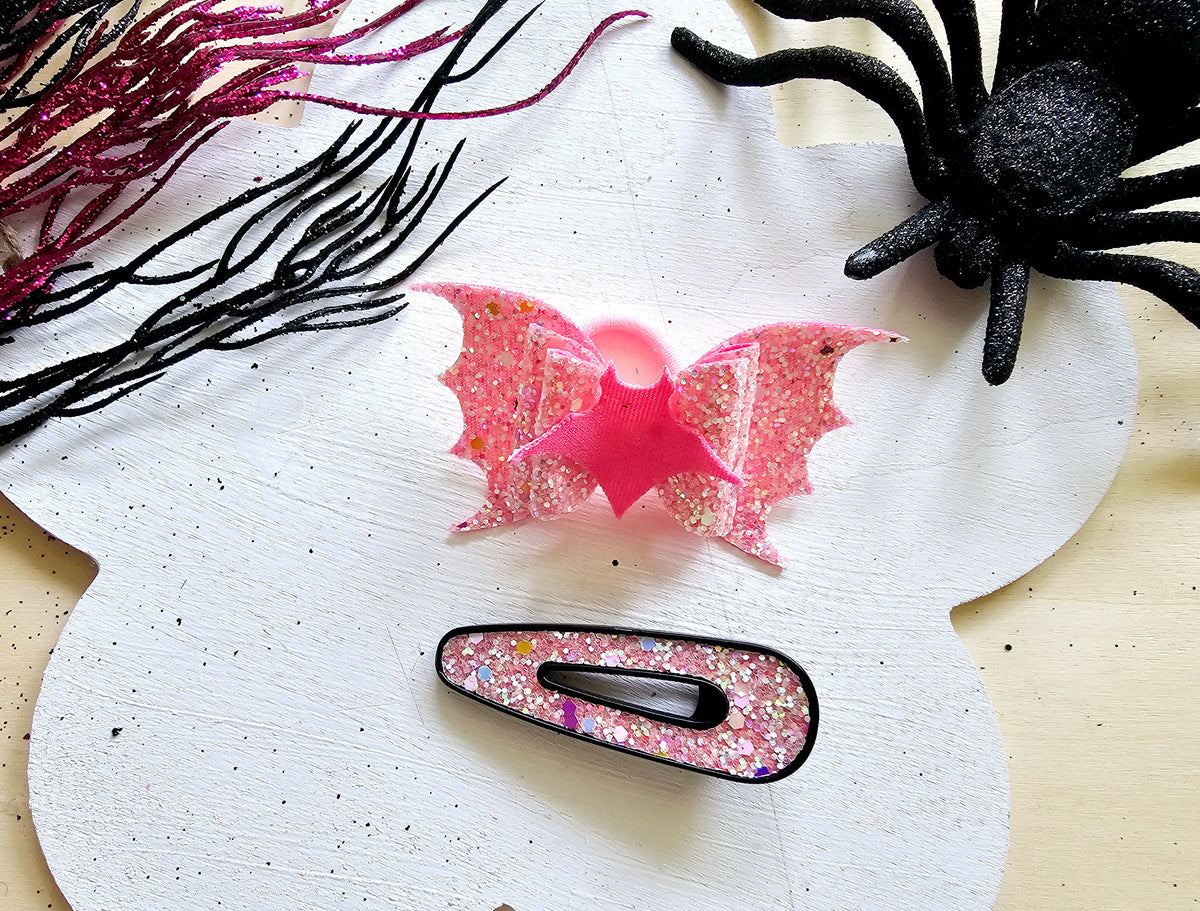 Glow in the dark vampire bat ponytail holder handmade from faux leather for Halloween hairstyles.