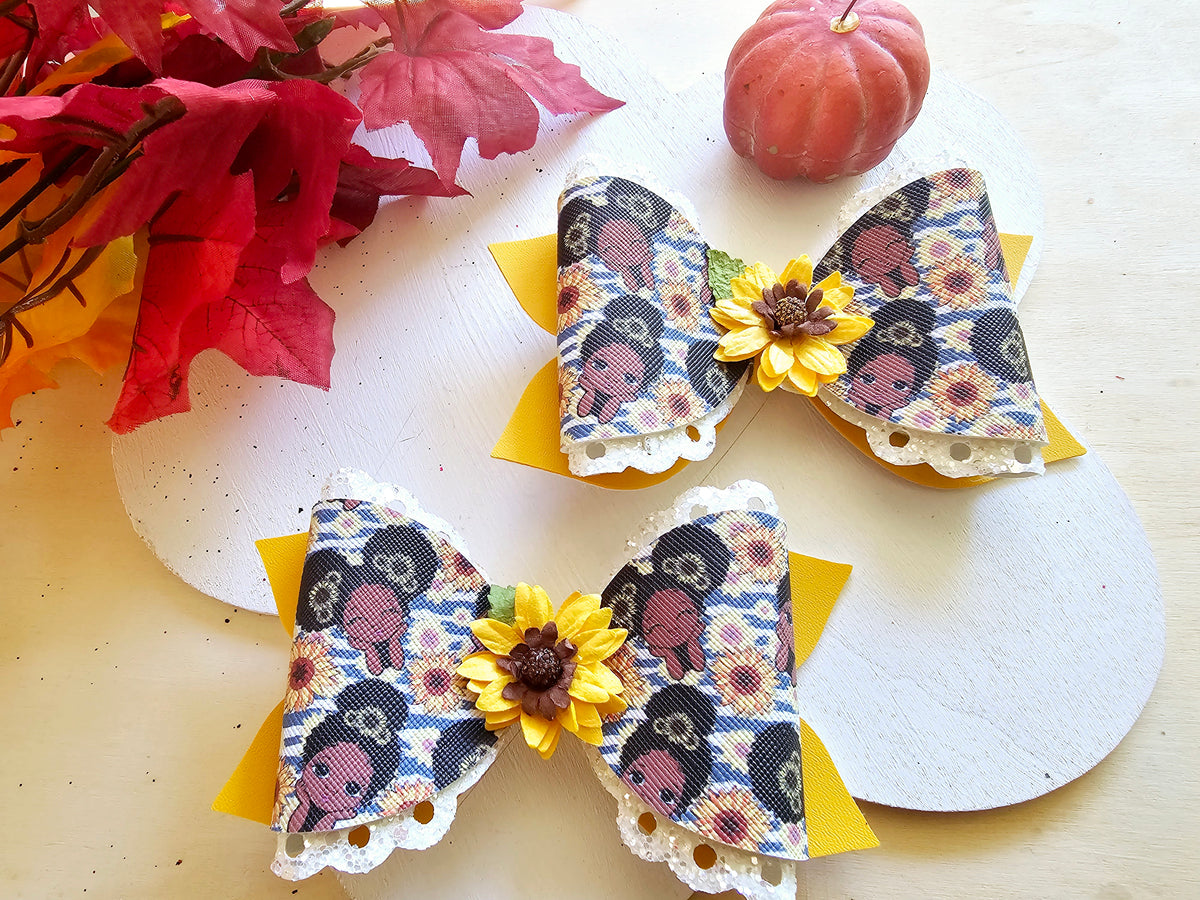 Handmade Sunflower Sweetie faux leather boutique hair bow featuring a sunflower centerpiece for babies, toddlers, and girls.