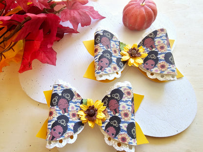 Handmade Sunflower Sweetie faux leather boutique hair bow featuring a sunflower centerpiece for babies, toddlers, and girls.