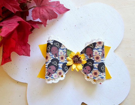 Handmade Sunflower Sweetie faux leather boutique hair bow featuring a sunflower centerpiece for babies, toddlers, and girls.