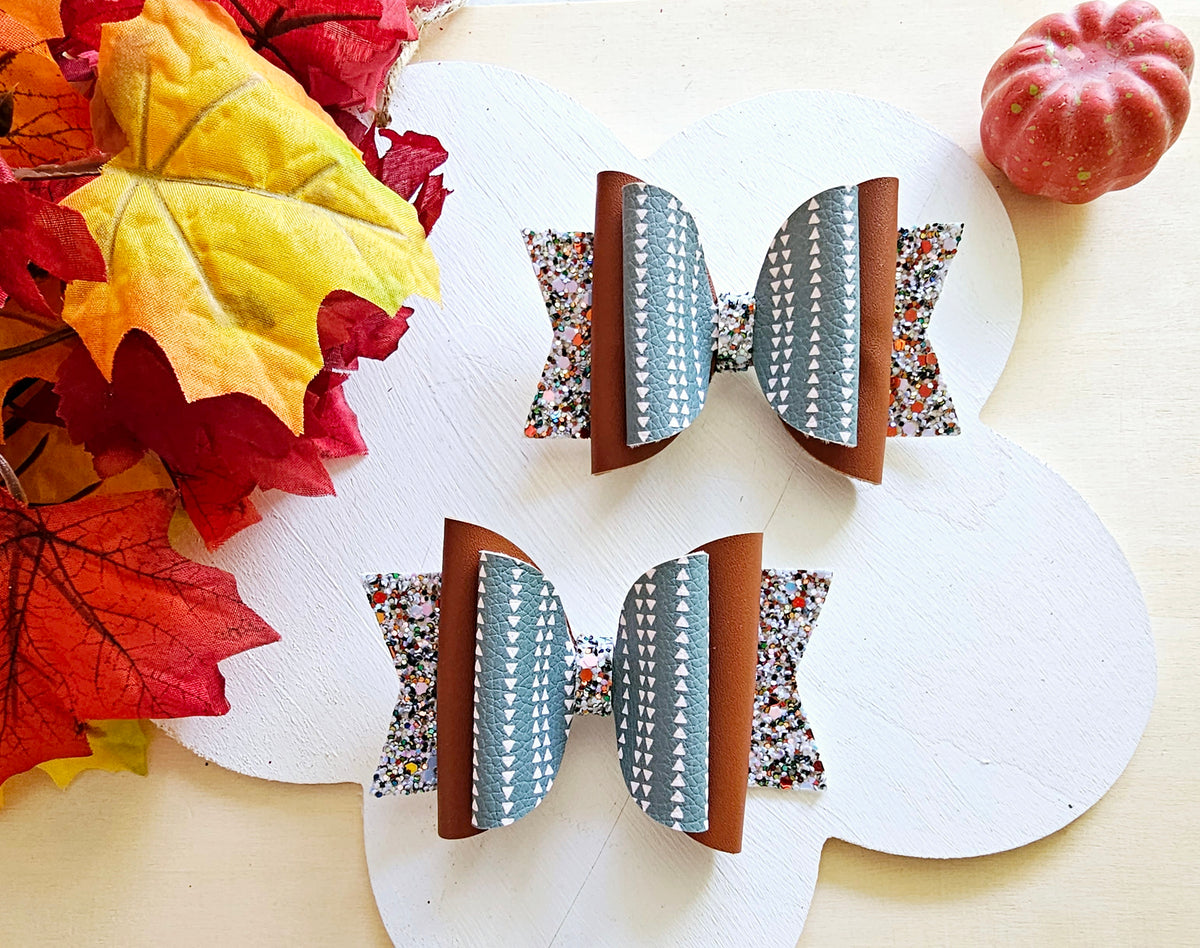 Handmade This Way or That Way faux leather boutique hair bow with neutral fall arrow-inspired design.