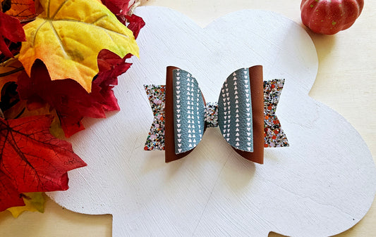 Handmade This Way or That Way faux leather boutique hair bow with neutral fall arrow-inspired design.