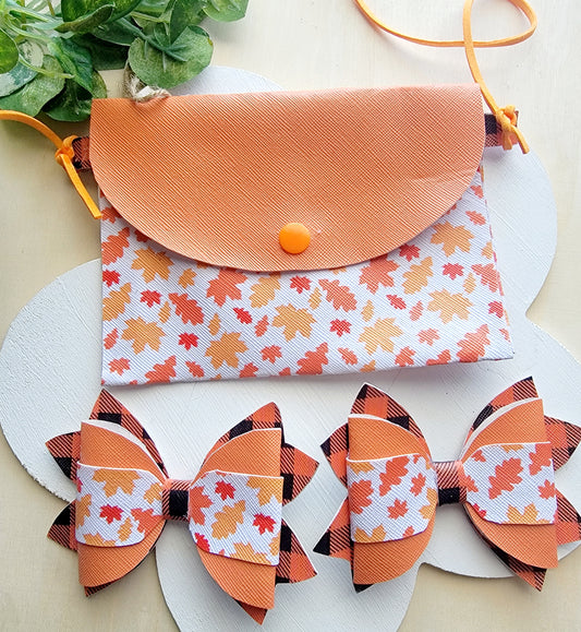 Girls' handmade fall accessory bundle with orange autumn leaf purse and matching orange plaid hair bows.