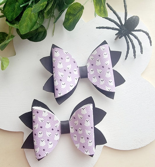 Handmade heat-changing Boo hair bow with adorable ghost print on faux leather for Halloween.