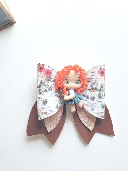 Large handmade fall hair bow with chocolate-brown faux leather layers, floral print, rose-gold glitter, and red-haired character centerpiece.