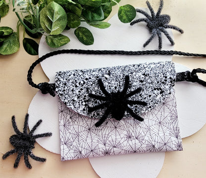 Handmade Spider Web Halloween accessory bundle with matching purse, hair bow, headband, and wristlet.